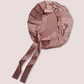 Picture of a pink hair bonnet demonstrating the pink colour for the gift box